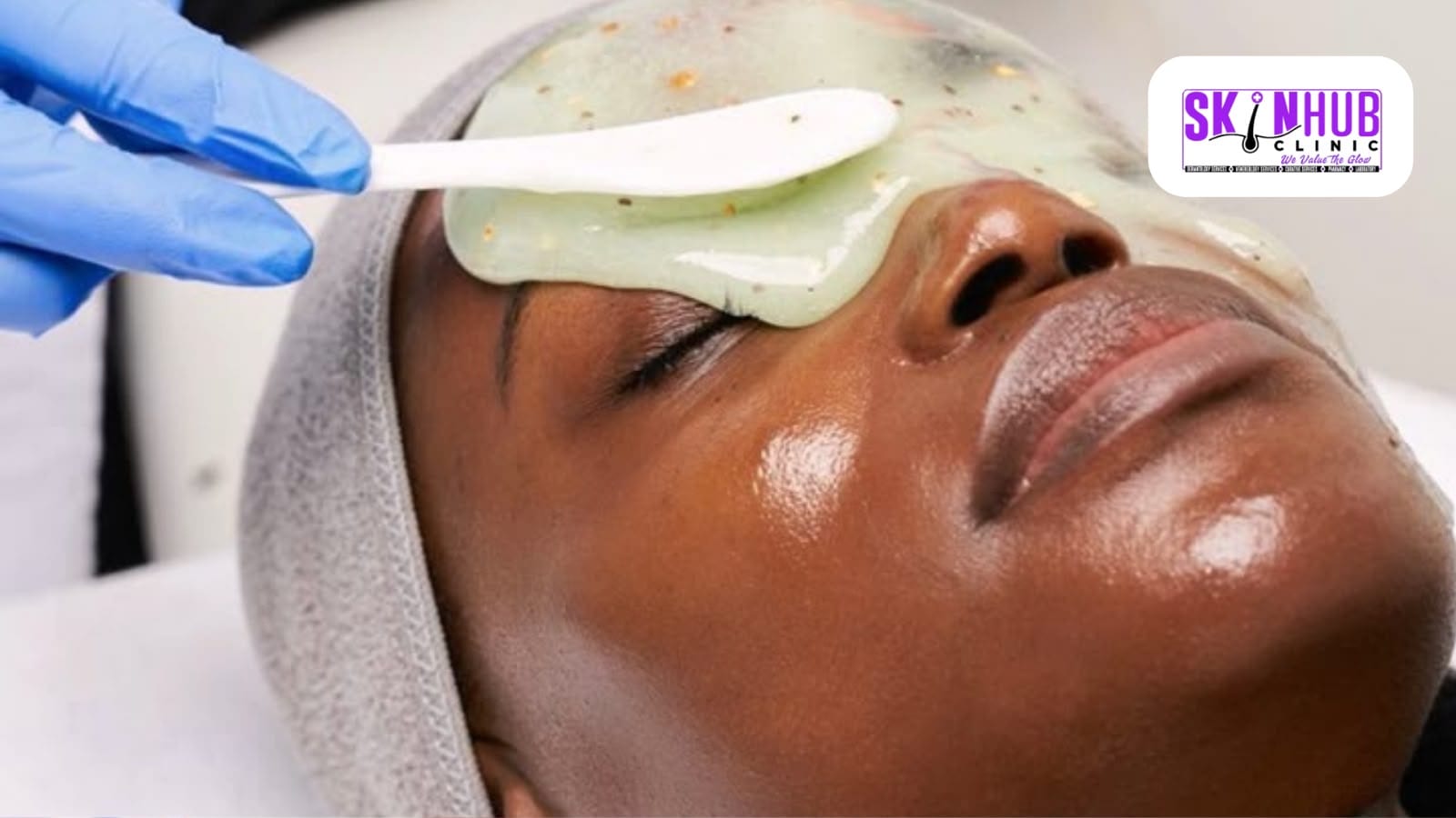 A peel solution being applied to a patient’s face with a spatula during a chemical peel